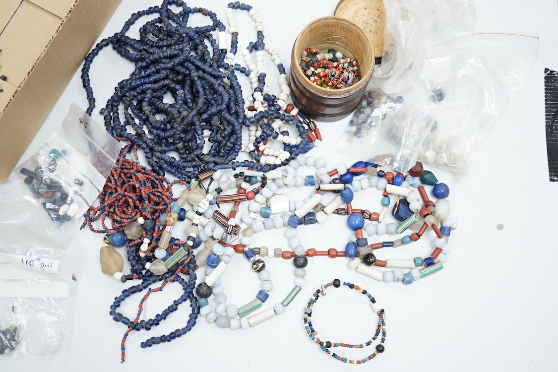 A pair of Turkish bath shoes, a collection of African beads and Middle Eastern vessels etc.